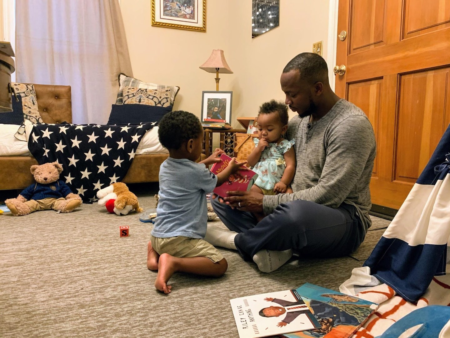 Family plays on comfortable carpet