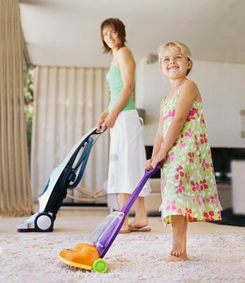 Mom and Daughter Vacuuming